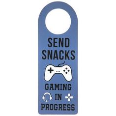 a blue door hanger that says, send snacks gaming in progress with a video game controller on it