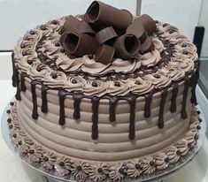 a cake with chocolate icing and decorations on top