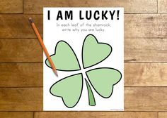 i am lucky st patrick's day card with pencil on wooden table next to it