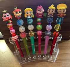 there are many different toy pens in the holder