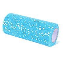 a roll of blue sequinized fabric with white dots on it's side