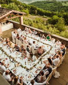 a large group of people sitting around a table