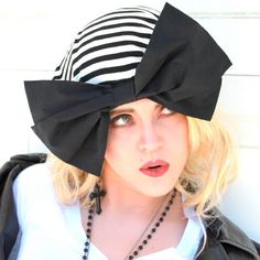 "Borderline Style Slouchy Beret Hat- Black & White Striped Knit with Black Bow a 1\" elastic soft band inside. One size fits all and will fit up to a 23\" head size or customized size upon request. All of Bella Starr hats are made and designed from my original patterns. Caring for your hat: Hand wash and hand dry A glamorous, hand-made, stylish hat, that complements your choice in fashion and defines your individual style. Accessorizing with a Bella Starr hat should always be playful, glamor Retro Black Beret For Winter, Black Flat Cap For Spring, Retro Black Hat For Spring, Black Cloche Hat One Size, Black Cloche Hat, One Size Fits Most, Vintage Black Hat One Size, Elegant Adjustable Black Beret, Black Spring Beret Cap, Black Brimmed Mini Hat One Size