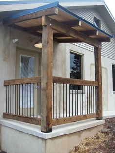 a porch covered with wood and metal railings