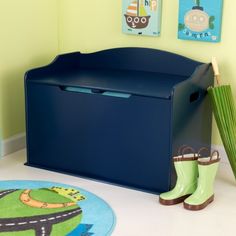 a child's toy storage box with rain boots and umbrella