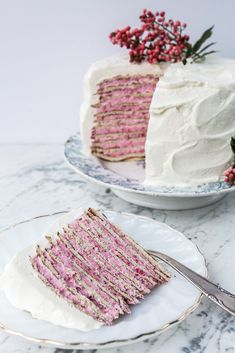 a piece of cake on a plate with a fork next to it and another slice missing