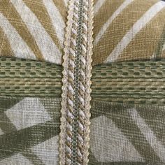 an upholstered fabric with braiding on it