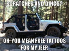 a jeep with the door open and two people in it driving through some trees, text reads scratches and dings? oh, you mean free tattoos for my jeep