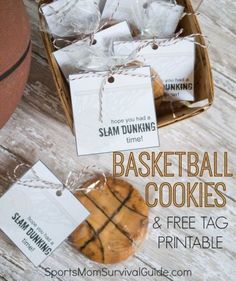 basketball cookies and free printable tags are on display in a basket next to a basketball