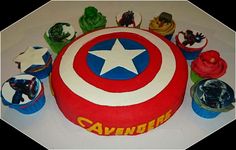 a birthday cake with cupcakes in the shape of avengers's shield and stars