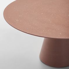 a round table that is made out of clay