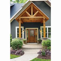 the front entrance to a house with wooden beams