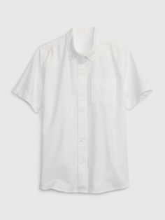 Smooth cotton oxford shirt.  Spread collar, button front.  Short sleeves.  Patch pocket at chest.  Made with 98% In-Conversion Cotton.  This product supports farmers making the three-year transition toward certified organic farming practices, which do not use synthetic pesticides and fertilizers.  This product was made in a factory that runs the Gap Inc.  P. A. C. E.  Personal Advancement & Career Enhancement) program.  P. A. C. E.  is our educational program that helps the women who make our cl Oxford Uniform, Uniform Shirt, Uniform Pants, Uniform Shirts, School Uniforms, Gap Kids, Pesticides, Oxford Shirt, The Gap