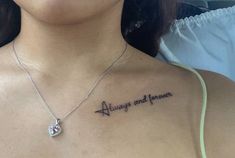 a woman with a tattoo saying always and forever on her chest