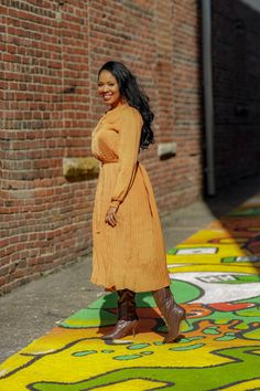 Pleated Camel Dress This pleated camel dress is a must have! Perfect for brunch, work or even a night out. You can pair with your favorite boots or sandals depending the season. This dress is a great transitional piece. Details: Gathered neck and wrists Long sleeves Comes w/ belt Comfortable Model is wearing a size small Fits true to size for most Model Measurements: Size: Medium • Height: 5'6 • Bust: 34 • Waist: 30 • Hips: 41.5 • Pleated Midi Dress For Work In Fall, Pleated Midi Dress For Fall Workwear, Fall Pleated Solid Midi Dress, Pleated Midi Dress For Fall, Fall Workwear Pleated Midi Dress, Fall Pleated Midi Dress For Date Night, Fall Beige Pleated Midi Dress, Modest Spring Midi Dress For Work, Chic Orange Pleated Midi Dress