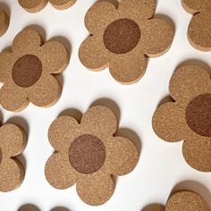 several pieces of cork with brown circles on them, arranged in the shape of flowers