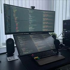 a computer monitor sitting on top of a desk