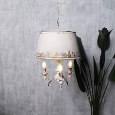 This French vintage-style chandelier brings a touch of rustic elegance and old-world charm to any space. Featuring a distressed lampshade and three candle-style arms, this unique pendant light is ideal for shabby chic, cottagecore, or farmhouse-inspired interiors. The beautifully weathered finish enhances its authenticity, creating a warm and inviting ambiance. Perfect for adding character to living rooms, dining areas, or entryways, this decorative fixture combines functionality with timeless s Cottage Chandelier Dining Room, French Country Pendant Lights, French Country Ceiling Fan, Farmhouse Ceiling Lights, Shabby Chic Lighting Fixtures, Farmhouse Dining Room Light Fixtures, Country Pendant Lighting, Shabby Chic Lighting, Shabby Chic Chandelier