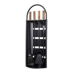 a black wall mounted rack with four brushes and two brooms in front of it