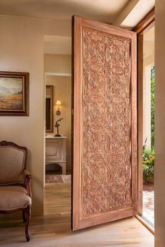 an open wooden door in a living room