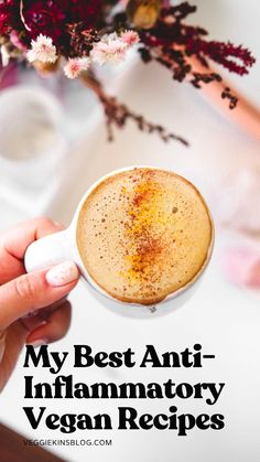 a person holding a cup of coffee with the words, my best anti - inflamatory vegan recipes