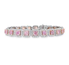 Pink diamonds are among the most sought-after gemstones in the world, celebrated for their rarity and the natural beauty of their color. This magnificent line bracelet comprises 20 dazzling pink natural diamonds—the pinnacle of luxury in a classic design. Each of these gems is certified by the GIA as natural fancy pink, with accompanying hues ranging from purple to orange, collectively weighing 6.47 carats. Complementing the pink diamonds are 3.01 carats of pristine white diamonds, creating a da Luxury Fusion Jewelry For Promise, Luxury Pink Gold Fine Jewelry Bracelets, Luxury Pink Jewelry For Festive Season, Luxury Mother's Day Jewelry With Diamond Accents, Luxury Pink Tennis Bracelet In Fine Jewelry Style, Luxury Pink Jewelry With Baguette Diamonds, Luxury Pink Tennis Bracelet For Formal Occasions, Luxury Pink Sapphire Fine Jewelry Bracelet, Pink Diamond Bracelet