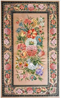 a large rug with flowers and leaves on the border is shown in pink, blue, yellow