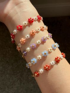 I know it's autumn now, but I can't help creating these bright, bling-bling flower bracelets! We offer five color options, each described in my own words:  ~ Red like strawberries  ~ Pink like strawberry-flavored crackers  ~ Blue like creamy, soft blue  ~ Purple like Muscadine grapes (a famous fruit from the Carolinas!)  ~ Matte red like maple leaves  Bracelet Info  Size: 0.8cm (Width) x 15cm (Length) with 5cm chain extender Overall size: 20cm (including chain extender) Finding Material: Gold-plated brass Beads: Seed beads, glass rondelle beads The fish line may be visible. Since each flower's length is fixed, custom bracelet lengths are approximate. Please leave a note about the bracelet length range if you prefer a longer/shorter bracelet. We strive to make each piece as close to your de Gold Bracelet Aesthetic, Flavored Crackers, Muscadine Grapes, Leaves Bracelet, Beaded Flower Bracelet, Bracelet Aesthetic, Fish Bracelet, Bff Bracelets, Fishing Bracelet