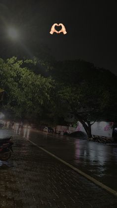 the street is flooded with water at night