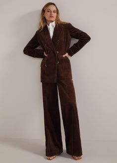 Soft corduroy gives The Agnes Blazer a throwback academic feel with a slightly oversized, yet tailored, fit. Flap pockets, faux horn buttons and striped lining make this double-breasted blazer a must. Pair it The Lana Cord Pant for head-to-tie styling. 100% CottonAdrianna is 5'9" wearing size Extra-Small Vintage Winter Coats Women, Women Double Breasted Suit, Dark Brown Suit Women, Corduroy Suit Women, Corduroy Blazer Outfit, Womens Business Suit, Vintage Winter Coat, Theatre Outfit, Corduroy Suit