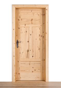 an open wooden door on top of a wooden table in front of a white wall