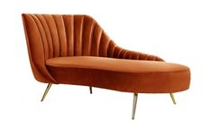 an orange velvet chair with gold legs