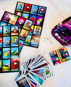 a table with cards, dices and other items for playing tarot on it