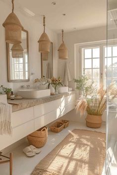 a bathroom with two sinks, mirrors and baskets on the counter top in front of it