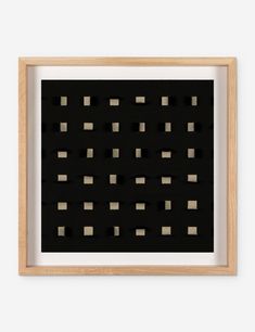 a framed black and white print with squares