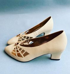 1930's style pumps with a cut out spiderweb design. Little brass spider detail.  Heel measures 5cm.  100% vegan.  Available in black, silver or cream.  I have a variety of sizes left of these so please get in touch with your size and colour preference and I'll check if I have them for you. Luxury Vintage Pointed Toe Court Shoes, Vintage Inspired Shoes Macy's, Affordable Vintage Closed Toe Heels, Womens Shoes 1920s, Womens 1940s Shoes, Luxury Vintage Round Toe Heels, 30s Shoes Heels, 20s Shoes Flats, Luxury Vintage Heels With Round Toe