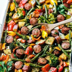 a casserole dish with sausage and vegetables