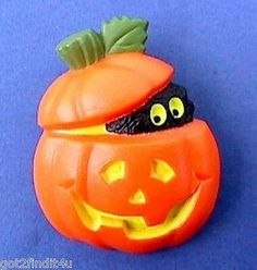 a plastic pumpkin shaped like a jack - o'- lantern with eyes and mouth