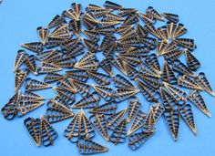 a pile of metal spikes on a blue surface