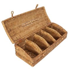 an open wicker box with six empty bottles in the bottom and two handles on each side