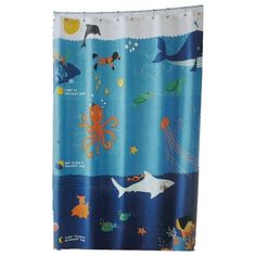 a shower curtain with an octopus, whale and other animals on it's side