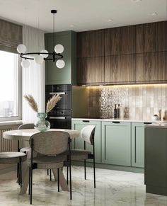 a modern kitchen with green cabinets and marble flooring, along with an oval dining table surrounded by beige upholstered chairs