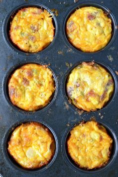 six muffins in a black pan on top of a table