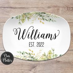 personalized oval platter with watercolor leaves on it