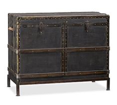 an old trunk with studded straps on the front and sides is shown in this image