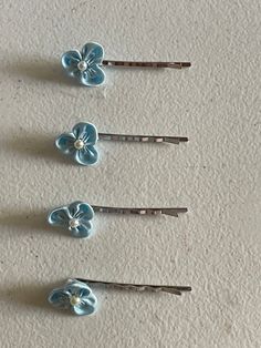 "THIS LISTING IS FOR ONE PAIR (two pieces), YOU MAY ADD MORE TO YOUR CART TO BUY MORE. A beautiful blue flower hair embellishment on a silver tone bobby pin. Perfect for just a touch of bling To hold bangs swept to the side nicely with this unique hair jewelry, or to embellish your up do Embellishment: dimensions: 1\" x 1\" = 2.5 cms Bobbie pin: 2'' or alligator clip; please write selection in the buyers notes; If, no selection is made, alligator clips will be sent by default. Color: Silver tone Flower Girls Hair, Pink Low Heels, Blue Hair Pins, Blue Wedding Hair, Blue Hair Accessories, Light Blue Flowers, Unique Hair, Flower Girl Hairstyles, Alligator Clips