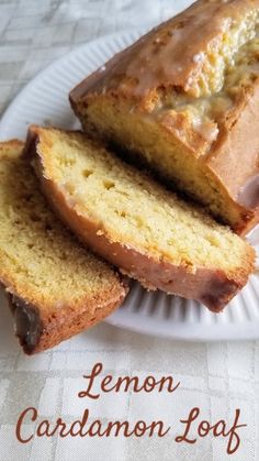 lemon cardamon loaf on a white plate with the words lemon cardamon loaf