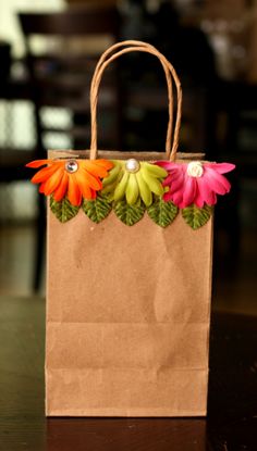 a brown paper bag with flowers on it