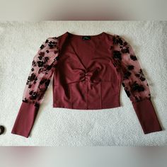 Burgundy Blouse. Size: Medium. (Material Has A Little Stretch To It) No Tears. No Stains. Smoke-Free Home Removed Tags But Never Used. Flowers Detailed On Sleeves. Selling It In Dark Green As Well. Fall V-neck Top With Sheer Sleeves, Fall Date Night Tops With Sheer Sleeves, Burgundy Tops For Fall Party, Burgundy Top For Fall Party, Fall Party Burgundy Top, Chic Burgundy Tops For Party, Elegant Stretch Burgundy Tops, Chic Burgundy Party Top, Fall Sheer Sleeves V-neck Tops