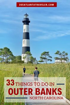 two boys walking down a path towards a light house with text overlay that reads 33 things to do in outer banks, north carolina